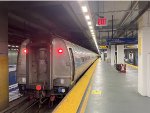 This is an Amfleet I combo cafe/business class car at NYP on Amtrak Train # 63